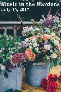 Music in the Gardens July 15, 2017 Two bouquets of flowers in gray buckets by Annie Spratt on Unsplash